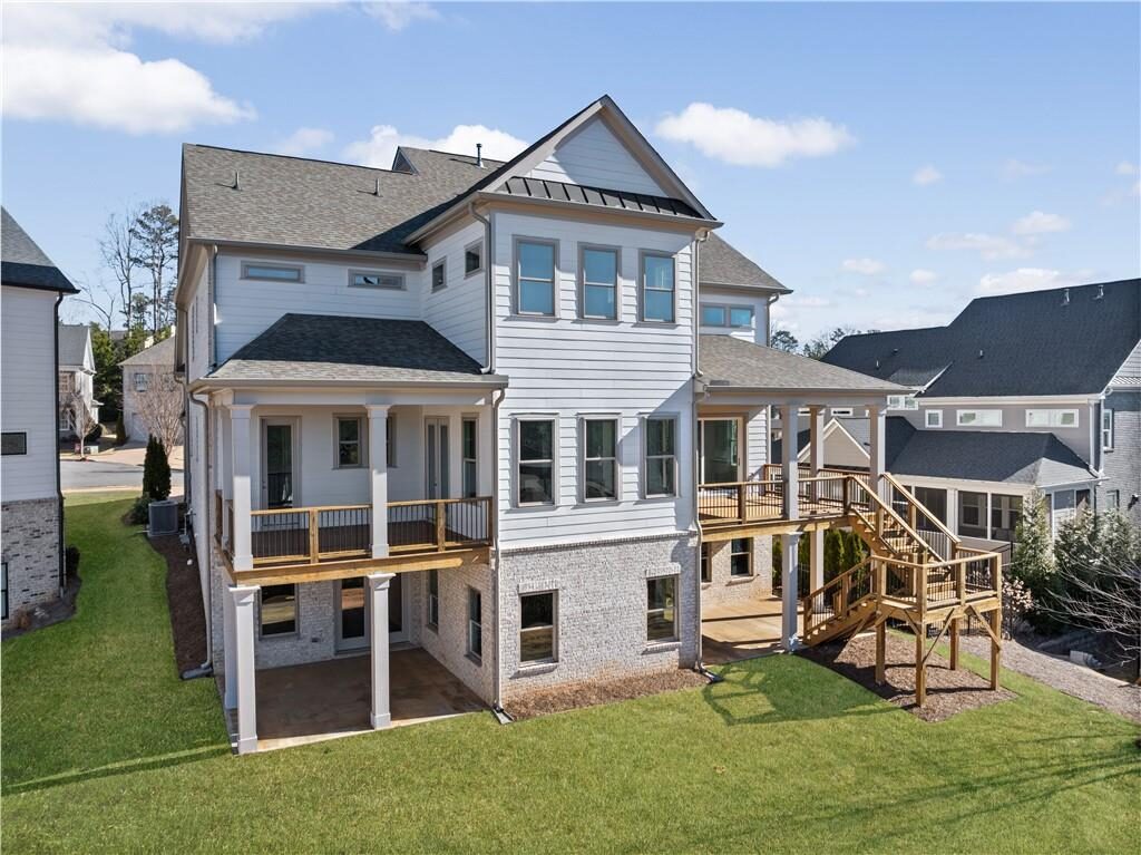 Back of the home with porches on two levels