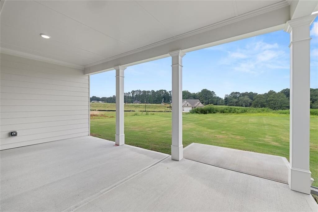 Covered porch overlooking open land