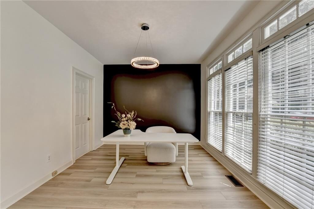 Home office with a wall of windows