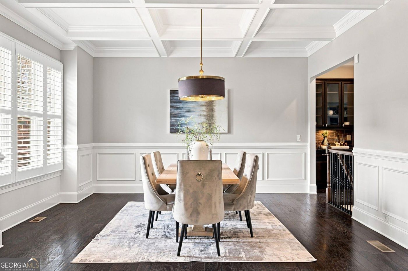 Formal dining room with a coffered ceiling