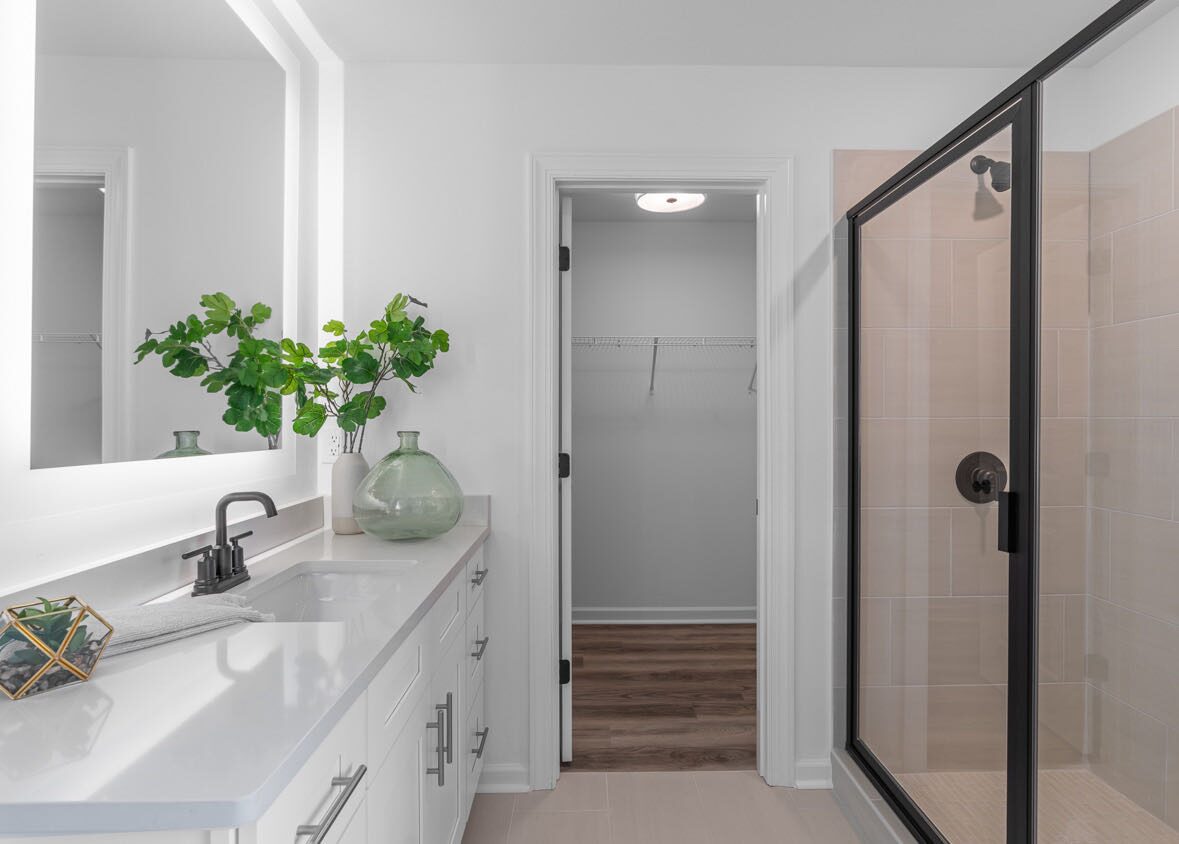 Primary bath with a walk-in shower and closet