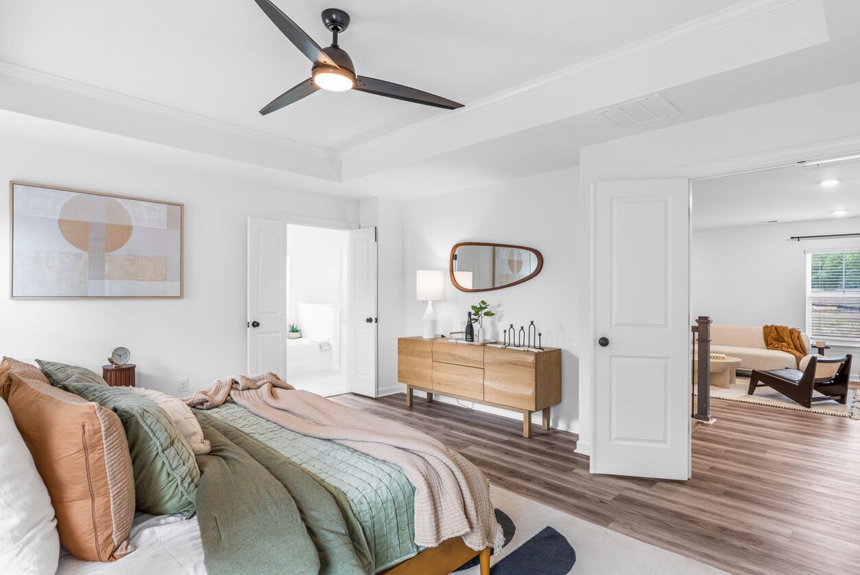 Primary bedroom with a tray ceiling