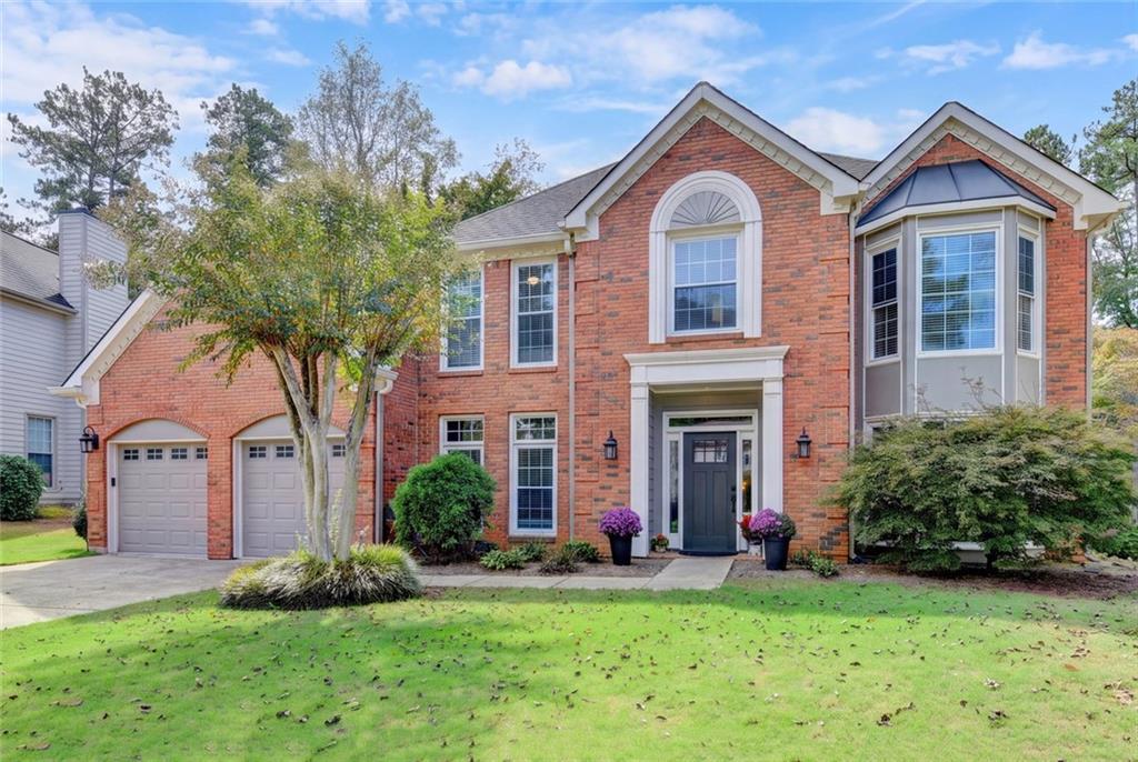 Brick front of the renovated home in Windgate, Johns Creek